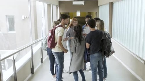 Smiling Students Taking Selfie in School Hallway