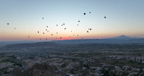 Aerial Cinematic Drone View of Colorful Hot Air Balloon Flying Over Cappadocia