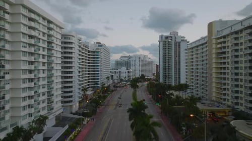 Evening in Modern City Borough with Multilane Trunk Road Lined By High Rise Apartment Buildings