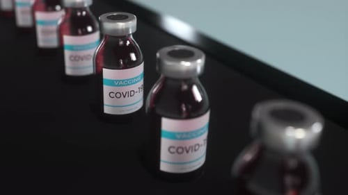 COVID-19 Vaccine Vials on Conveyor Belt