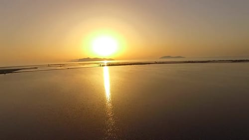 Aerial view of a lake at sunset.
