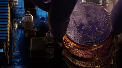 Bitcoin BTC Coins in CPU Central Processor Socket on Digital Pc Motherboard Mining Cryptocurrency