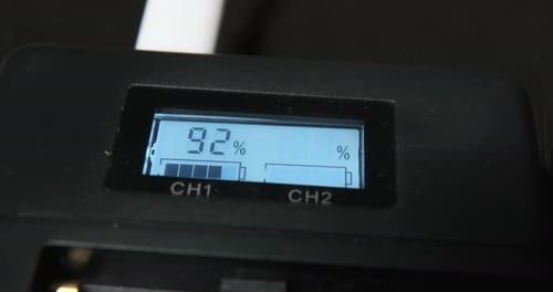 Screen of Charger Shows Data of Battery Percent on Table