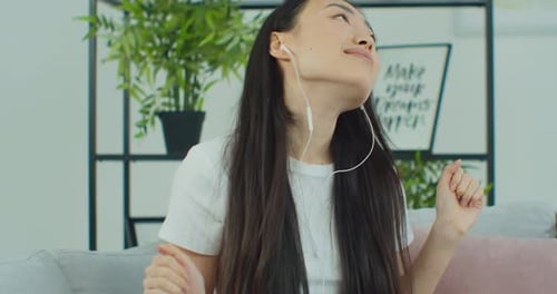 Woman Listening to Music at Home, Relaxing
