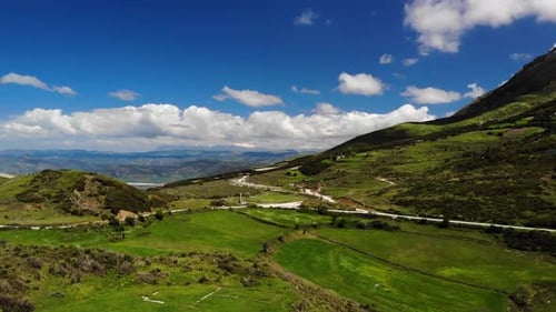 Green Hills and Open Fields: Rural Aerial View
