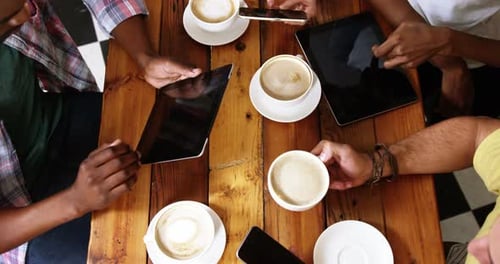 Friends Relaxing with Coffee and Using Technology