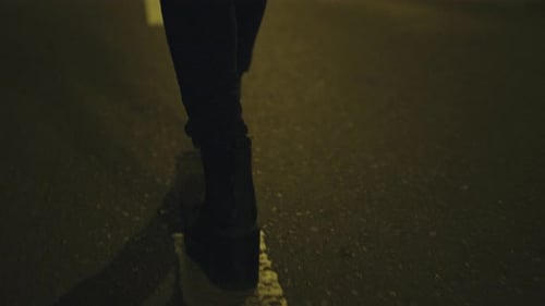 Girl Walking on Street Alone in Boots on Road Downtown City Centre