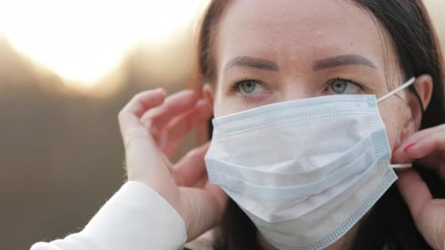 Woman with Medical Mask to Protect Her From Virus