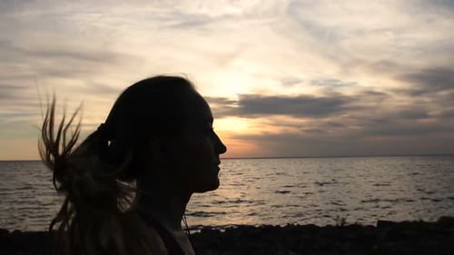 Running Fit Woman Jogging on the Beach at Sunset