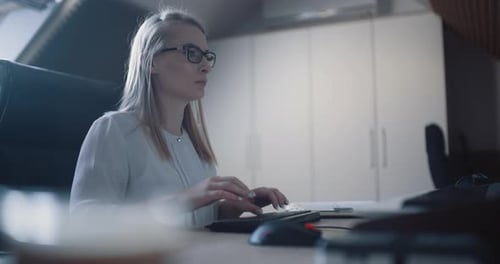 Woman Working in Office at Home
