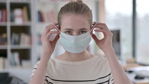 Portrait of Young Woman Wearing Protective Face Mask