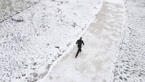 Aerial Photography of a Track and Field Athlete in Winter