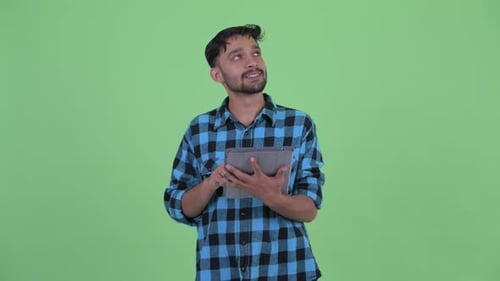 Man Using Tablet, Thinking on Green Screen