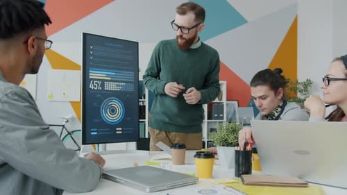 Slow Motion of Business Man Making Presentation in Office with Digital Screen