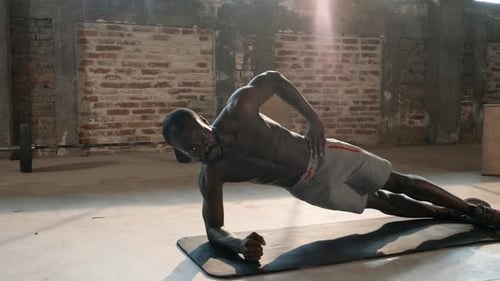 Sport man doing plank exercise, fitness workout at gym