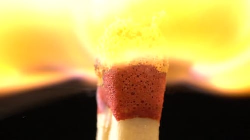 Match Instantly Lights Up and Goes Out. Slow Motion. Black Background. Close Up