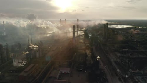Emission To Atmosphere From Industrial Pipes. Smokestack Pipes Shooted with Dron