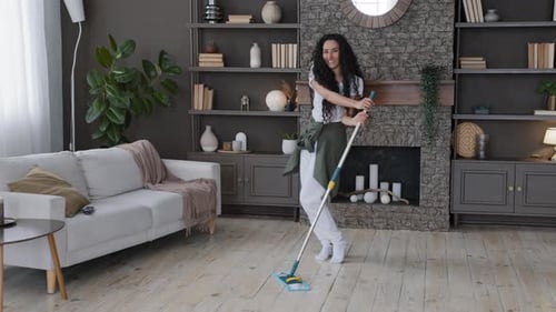 Woman Enjoys Mopping the Floor and Dancing