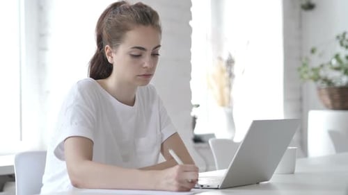 Writing Young Woman Paperwork