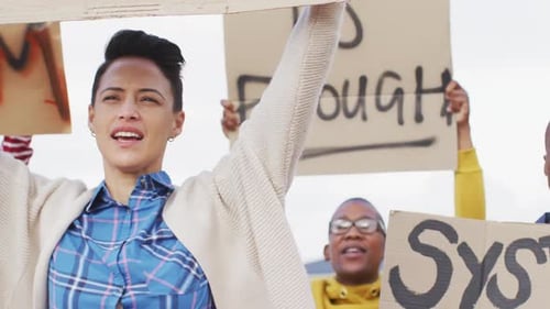 Diverse Group Protesting and Marching Outdoors