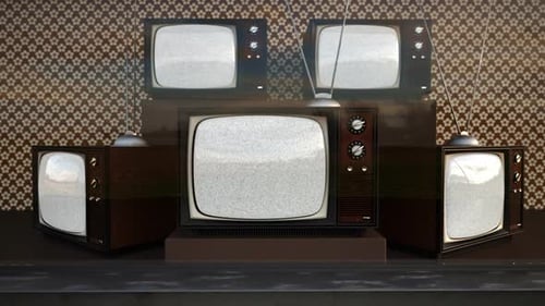 An exhibition of old-fashioned retro color tv sets with tuner antennas.