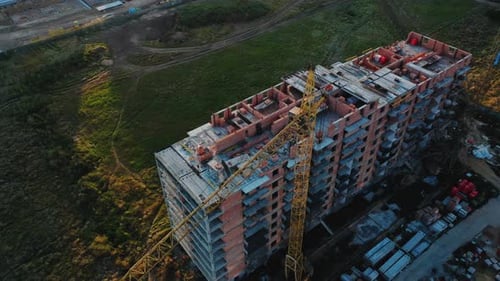Aerial View of the Construction Site of a Residential Building at Sunset on a Summer Day