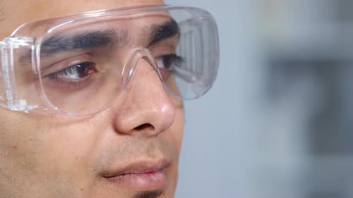 Close up of Scientist Wearing Clear Protective Glasses