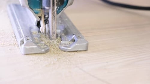 Jigsaw Cutting Through Wood Close Up