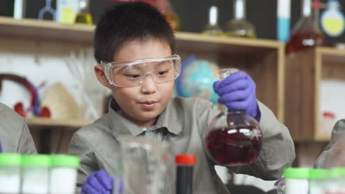 Excited Child Doing Science Experiment in Lab