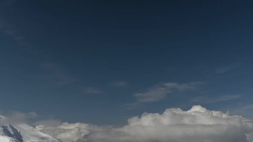Time lapse view of clouds in blue sky