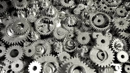 Seamless loop animation of a bunch of dark metallic gears laying on the heap.