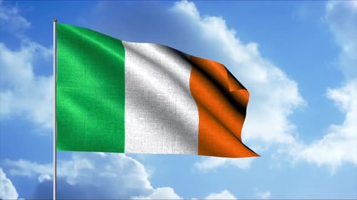 Waving Irish National Flag Against Blue Sky