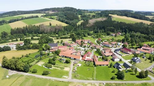 Aerial Drone Shot a Village Surrounded By Fields and Forests in a Rural Area