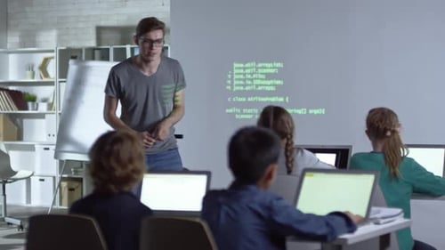Coding Class with Young Adult Teacher and Students