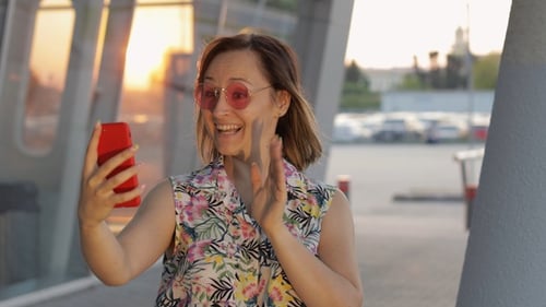 Woman Records Selfie Video at Sunset