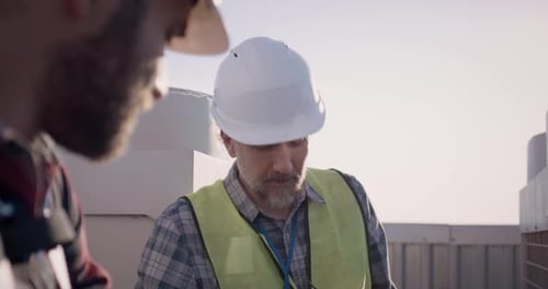 Engineers Having a Break on a Cell Tower