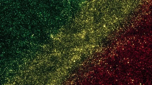 Abstract Green Yellow Red Glittering Particles Background