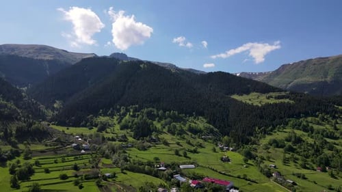 Picturesque Village Nestled Among Lush Mountains