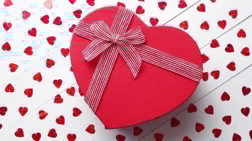 Heart Shaped Gift Box Surrounded by Confetti