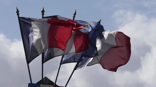 French and EU Flags Waving in the Wind