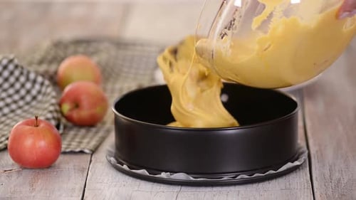 Pouring Apple Cake Batter into Baking Pan