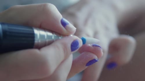 Electric File Removes Violet Nail Polish