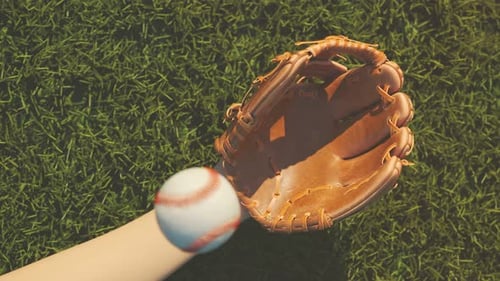 Baseball catch on a stadium grass background. Epic slow motion shot 4KHD