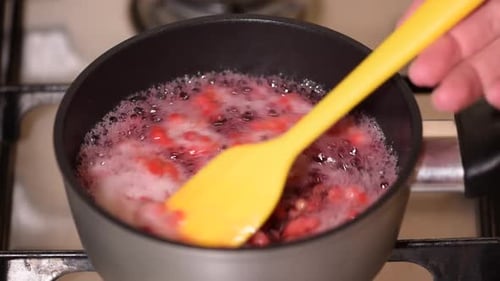 Cooking Red Fruit Mixture on Stove Top