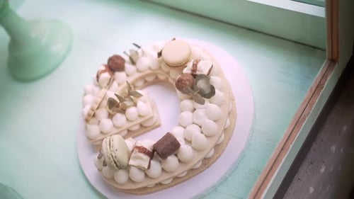 Festive Letter Cake Decorated With Macarons