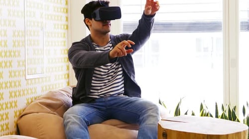 Man Using Virtual Reality Headset Indoors