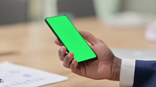 African Businessman Using Smartphone with Chroma Screen Close Up