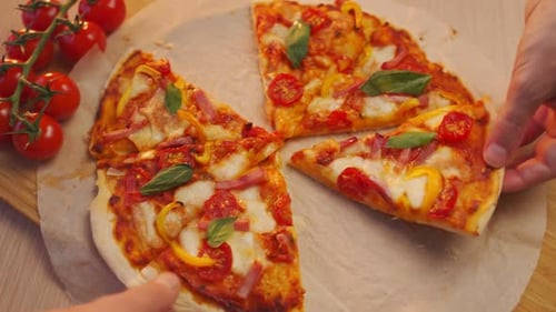 Removing Pizza Slices from a Delicious, Topped Pizza