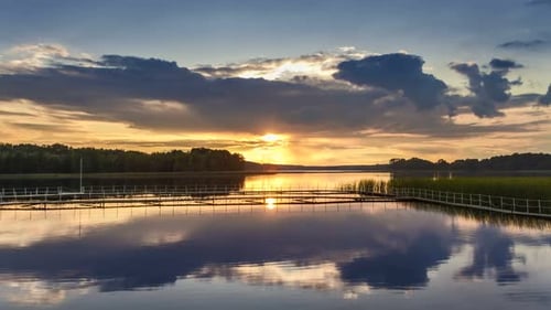 Beautiful sunset over the lake with mirror reflection in autumn, timelapse, 4K