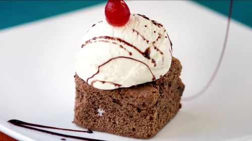 Decadent Chocolate Brownie with Ice Cream and Cherry